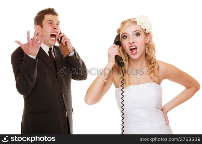 Wedding relationship difficulties. Angry woman and fury man talking on the phone. Couple bride and groom quarrelling screaming isolated on white.