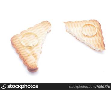 wedding rings and cookies on a white background