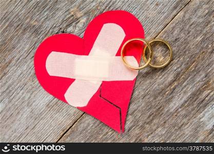 Wedding rings and heart fixed with plaster