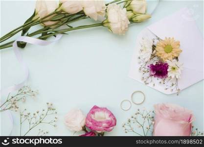 wedding rings flower decoration blue pastel background. Resolution and high quality beautiful photo. wedding rings flower decoration blue pastel background. High quality beautiful photo concept