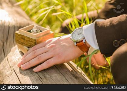 wedding rings in a wooden box on the tree