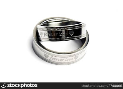 Wedding rings of Forever Love isolated on white