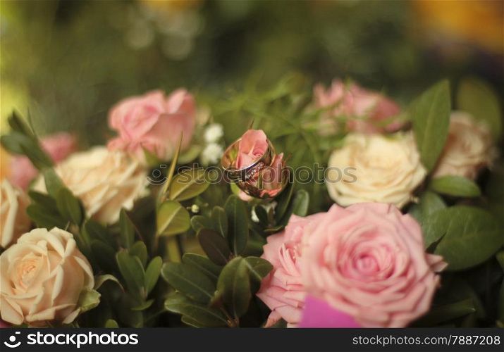 Wedding rings on a flower. Shallow depth of field.
