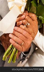 Wedding rings on old people hands. Wedding old people