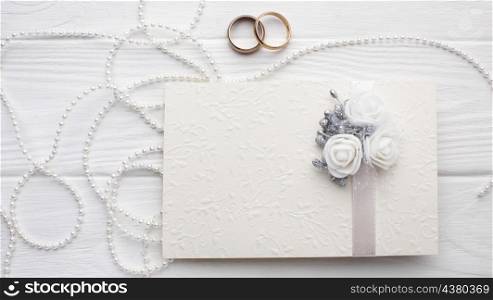 wedding rings peals with invitation envelope