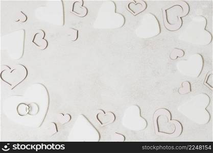 wedding rings white heart shape concrete backdrop