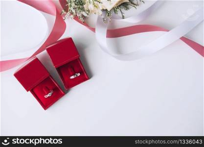 Wedding rings with bouquet of flowers