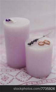 wedding rings with wedding decor of dried flowers