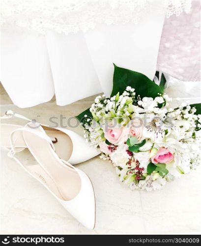 Wedding shoes and wedding bouquet