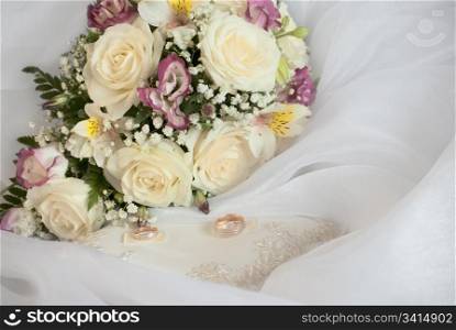 wedding still life. bridal bouquet and the ring