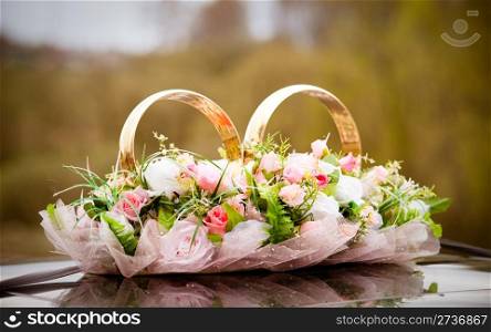 Wedding symbols - bunch of flowers and couple of rings