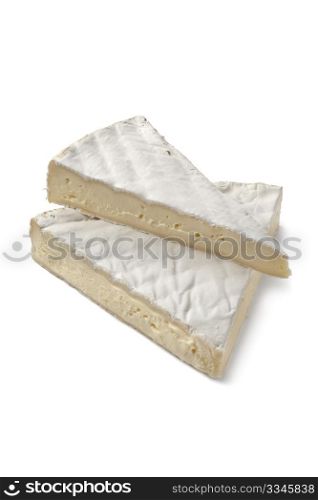 Wedges of French Brie cheese on white background