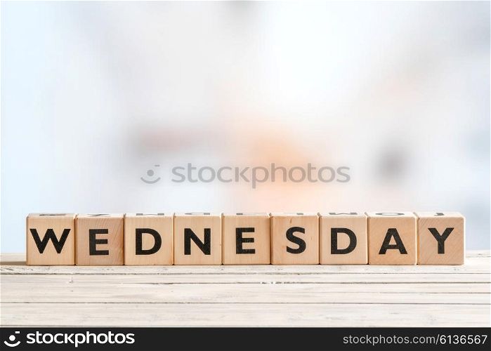 Wednesday sign with wooden cubes on a table