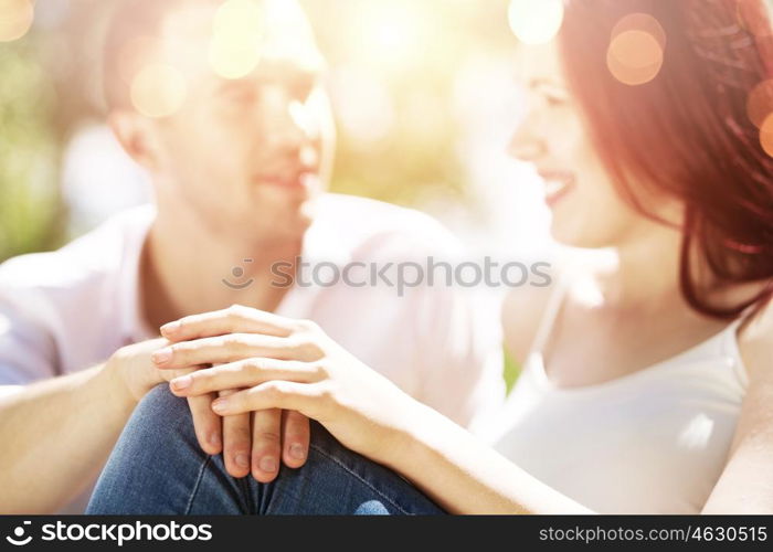 Weekend in park. Young couple in love having fun and enjoying the beautiful nature