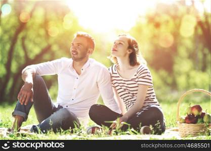 Weekend in park. Young couple in love having fun and enjoying the beautiful nature