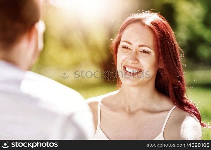 Weekend in park. Young couple in love having fun and enjoying the beautiful nature