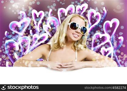 Weekend party. Young pretty woman in sunglasses with blank white banner
