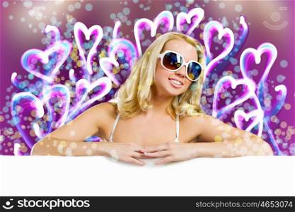 Weekend party. Young pretty woman in sunglasses with blank white banner