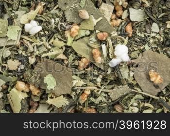 weight loss and detox herbal tea with oolong tea, lotus leaf, rice tea, green tea, Buddha tea,lemon balm and balsam pear - closeup background