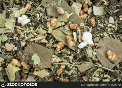 weight loss and detox herbal tea with oolong tea, lotus leaf, rice tea, green tea, Buddha tea,lemon balm and balsam pear - closeup background