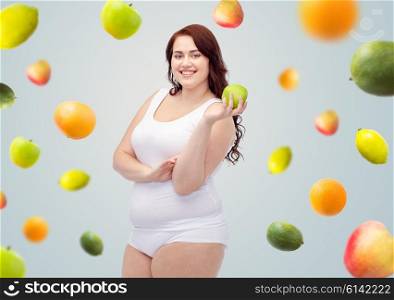 weight loss, diet, slimming, healthy eating and people concept - happy young plus size woman in underwear with green apple over gray background with fruits