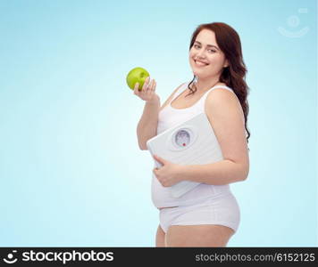 weight loss, diet, slimming, healthy eating and people concept - happy young plus size woman in underwear holding scales and green apple over blue background
