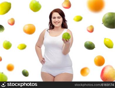 weight loss, diet, slimming, healthy eating and people concept - happy young plus size woman in underwear with green apple over fruits background