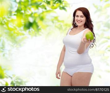 weight loss, diet, slimming, healthy eating and people concept - happy young plus size woman in underwear with green apple over natural background