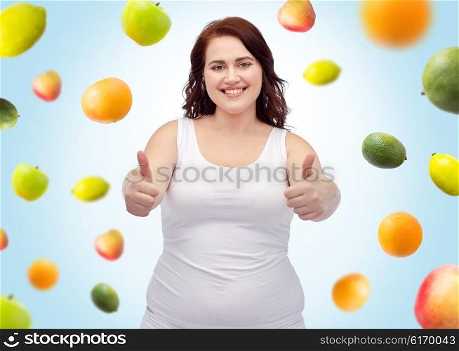 weight loss, diet, slimming, healthy eating and people concept - smiling young plus size woman in underwear showing thumbs up over blue background with fruits