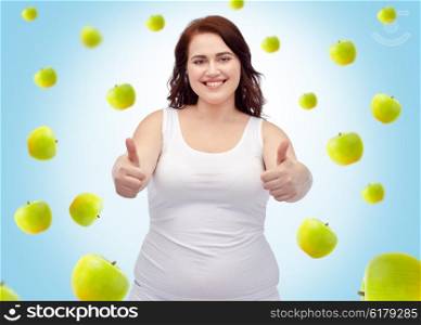 weight loss, diet, slimming, healthy eating and people concept - smiling young plus size woman in underwear showing thumbs up over blue background with green apples