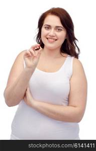weight loss, diet, slimming, medicine and people concept - happy plus size woman in underwear with pill