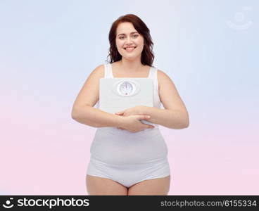 weight loss, diet, slimming, plus size and people concept - happy young plus size woman in underwear holding scales over rose quartz and serenity gradient background