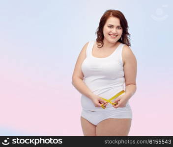 weight loss, diet, slimming, size and people concept - happy young plus size woman in underwear measuring tape over rose quartz and serenity gradient background