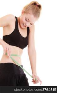 Weight loss, healthy lifestyle concept. Green measuring tape on woman body, fit girl measuring her waistline