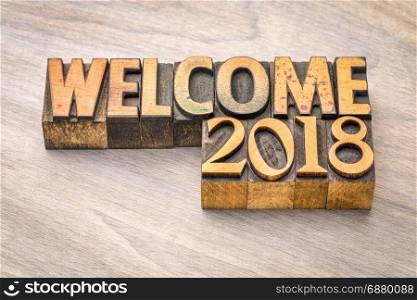 Welcome 2018 - banner in vintage letterpress wood type printing blocks, New Year concept