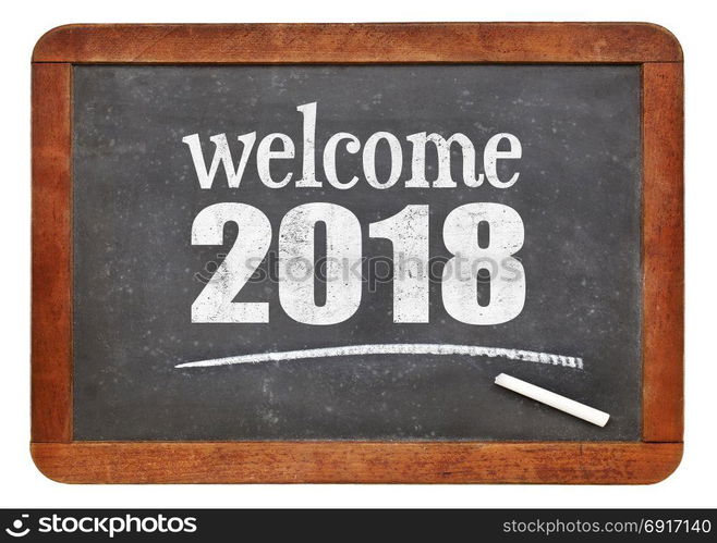 Welcome 2018 - New Year concept on a vintage slate blackboard isolated on white