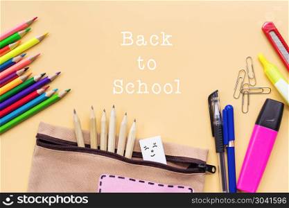 Welcome back to school background, colorful color pencil and sta. Welcome back to school background, colorful color pencil and stationery bag on yellow backgrounds with copy space