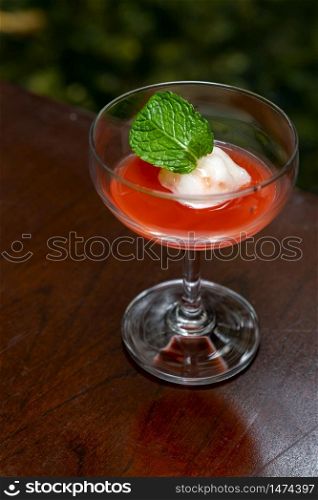 Welcome drink red mocktail on wooden table