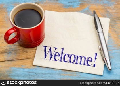 Welcome informal sign - handwriting on a napkin with a cup of coffee