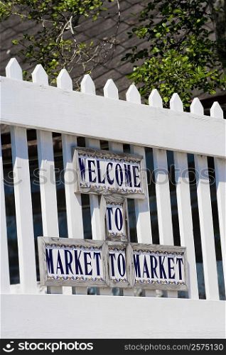 Welcome sign on a picket fence, St. George Street, St. Augustine, Florida, USA