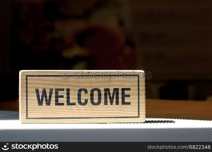 welcome sign on counter bar in coffee shop