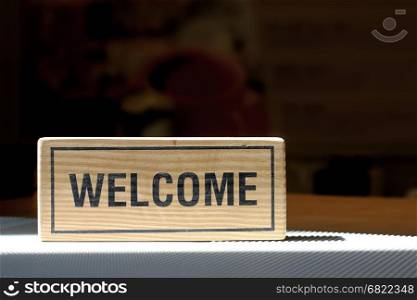 welcome sign on counter bar in coffee shop