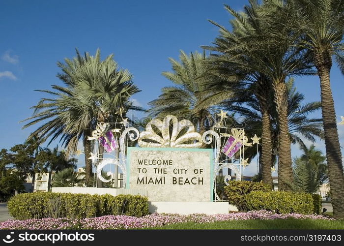 Welcome signboard in a garden, Miami Beach, Florida, USA