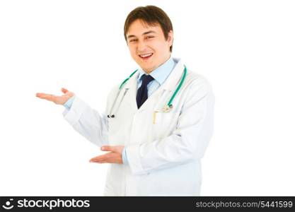 Welcome! Smiling young medical doctor inviting to cooperation isolated on white&#xA;