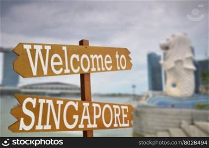 Welcome to Singapore sign with Merlion in background