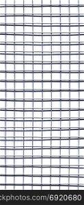welded wire mesh background. grey welded galvanized steel wire mesh grid with shadow useful as a background