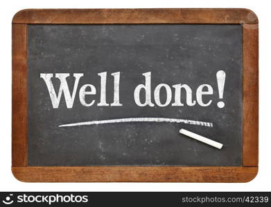 Well done sign - white chalk text on a vintage slate blackboard