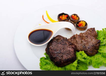 Well done steak served in the plate