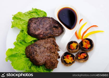 Well done steak served in the plate