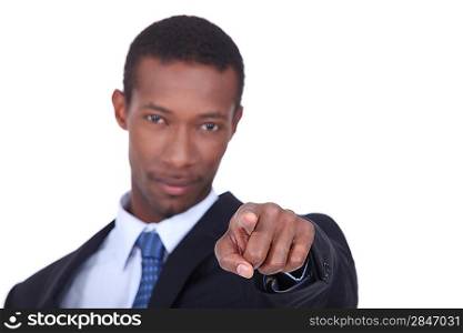 well dressed black man pointing his finger on us